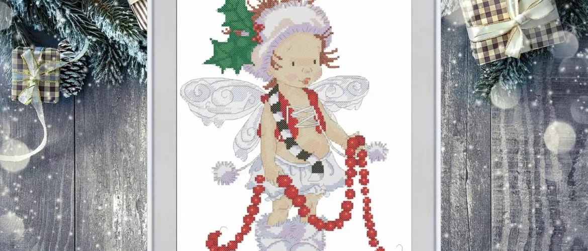 Cross stitch pattern of a Christmas fairy with holly leaves, wings, and a red garland, detailed festive embroidery design on white background.