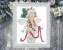 Cross stitch pattern of a Christmas fairy with holly leaves, wings, and a red garland, detailed festive embroidery design on white background.